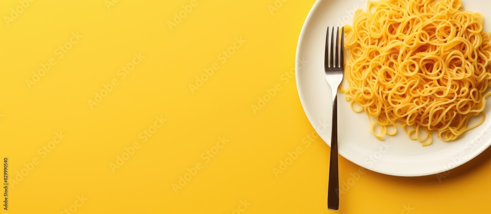 Leinwandbilder a copy space image featuring a plate of instant noodles on a yellow background with a fork
