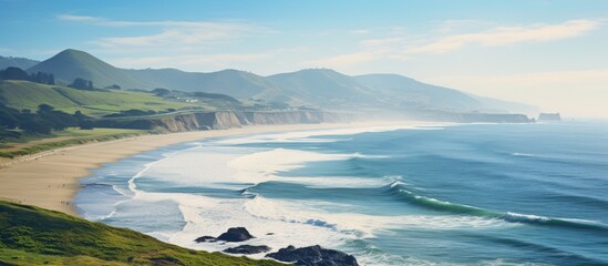 An idyllic coastal scene with a picturesque combination of sandy beaches rolling hills and a breathtaking view of the Pacific Ocean The image captivates viewers with its serene beauty and vast open s