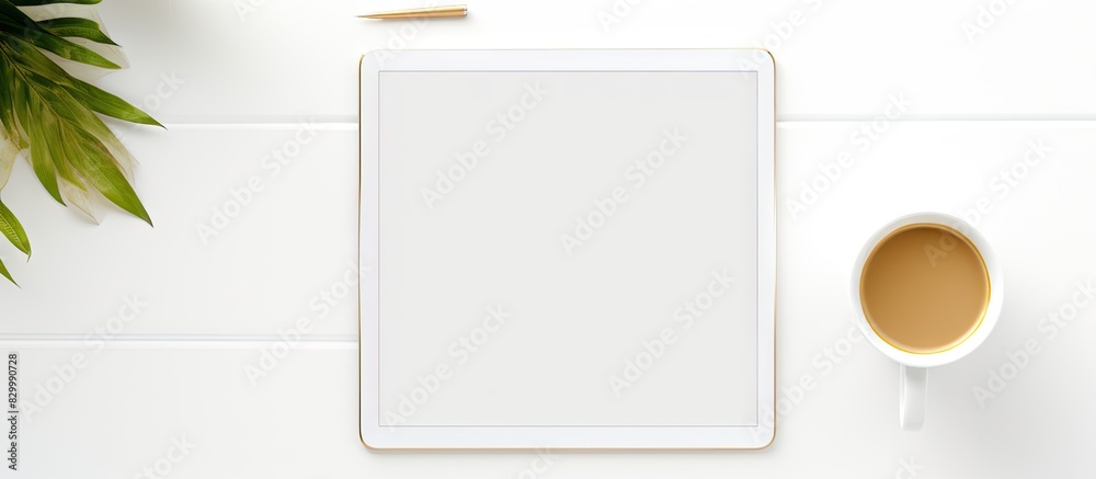 Aufkleber a copy space image of a tablet and gold notebook on top of an office white desk in a flat lay photo