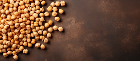 Closeup of uncooked dry chickpeas on a concrete background providing a horizontal composition with copy space for adding text or other graphics