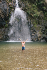 woman enjoy  at waterfall jokkadin