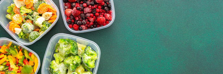 Ice cubes with frozen berries and fruits and mint on a red background