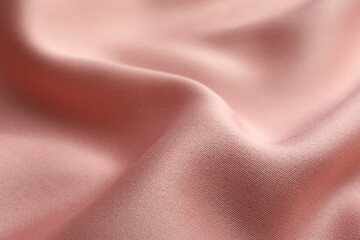 Texture of pink silk fabric as background, closeup