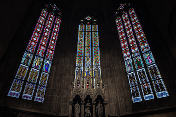 Gothic cathedral interior with stained glass window
