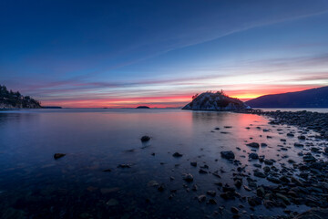 Whyte Islet at sunset, twilight, or dusk with pink and purple skies near Vancouver, Canada