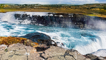 Fototapeta premium Panoramic summer view of popular tourist destination - Gullfoss waterfall. Dramatic sunrise on Hvita river. Incredible morning scene of Iceland, Europe. Traveling concept background.