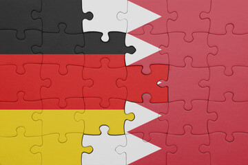 puzzle with the colourful national flag of bahrain and flag of germany.