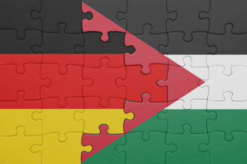 puzzle with the colourful national flag of jordan and flag of germany.