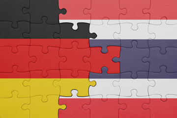 puzzle with the colourful national flag of thailand and flag of germany.