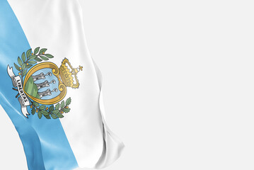 National flag of San Marino flutters in the wind. Wavy San Marino Flag. Close-up front view.