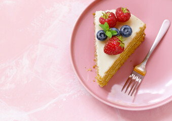 honey cake dessert on a plate on a pink background