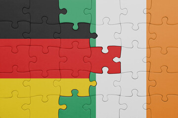 puzzle with the colourful national flag of ireland and flag of germany.