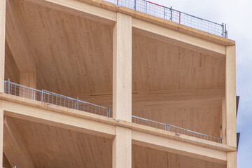Detail of the vertical supports and interior ceiling of a mass (solid) timber multi story...