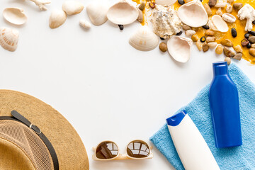 Sunbathe accessories with sea sand and shells, top view. Beach flat lay