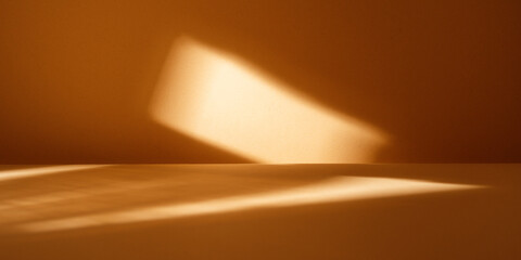 Table on smooth background with abstract sunlight and shadows on the wall. Mock up for branding...