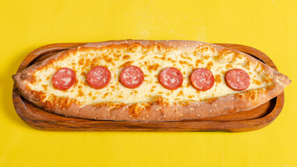 Sausage pide on tray top view