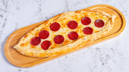 Sausage pide on tray top view