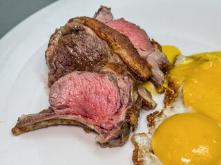 Delicious grilled lamb chops and fried eggs