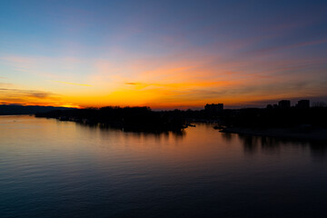 Fototapeta premium Tranquil sunset over Danube river in Novi Sad, Serbia in winter evening