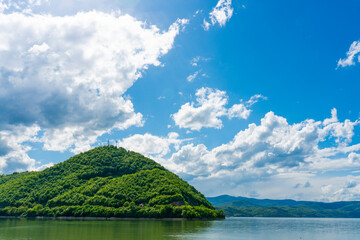 Serene green hill overlooking Porec bay in Danube gorge in Serbia on a sunny day