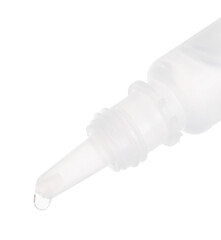Dripping medical drops from bottle on white background