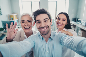 Photo of business people make selfie photo smiling greeting in modern office