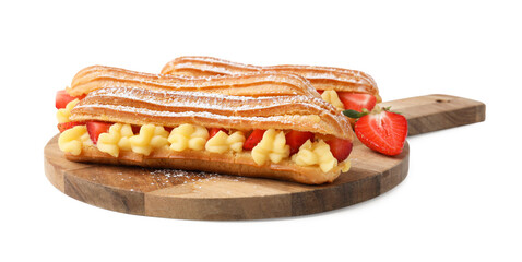 Delicious eclairs filled with cream and strawberries isolated on white