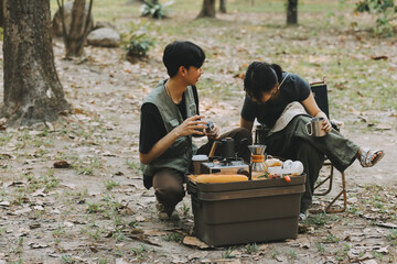 Asian couple sweet in tent inside on they camping trip, traveller relax and sleep togather in out door and camping trip