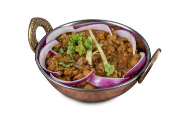 A traditional Indian copper serving dish full of  Indian or Punjabi or Pakistani chick pea Chana Masala curry isolated on white
