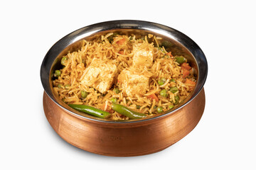 Indian cuisine paneer biryani, rice and cheese and vegetables served in a  traditional copper dish  isolated on white