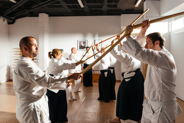 Students Practicing Wooden Sword Techniques in a Traditional Martial Arts Dojo