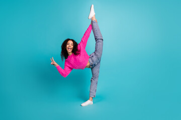 Full length photo of lovely teen lady flexible split v-sign dressed stylish pink garment isolated...