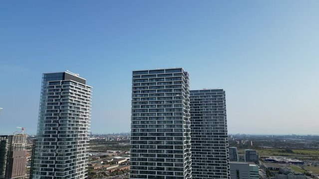 Drone aerial fly over highrise buildings in day time in Vaughan Ontario Canada