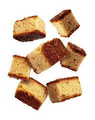 Pieces of sponge cakes flying isolated from the white or transparent background