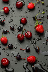 Wet beWet berries on a black backgroundrries on a black background