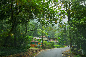 Darjeeling,West Bengal,India - 10th August 2023 : Rural village and a concrete road passing through...