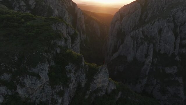 Turzii Gorges (Cheile Turzii in Romanian) aerial 4k video. Beautiful sunset landscape with this amazing mountain landmark from Apuseni Mountains. Travel to Transylvania, Romania.