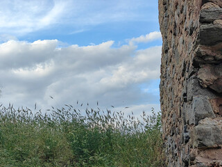 Echoes of History. The Majestic Old Fortress Isar of Macedonia Amidst Grass and a Cloud-Kissed Blue...