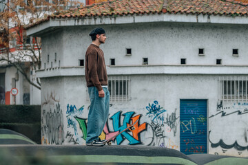 young man on the street with skateboard