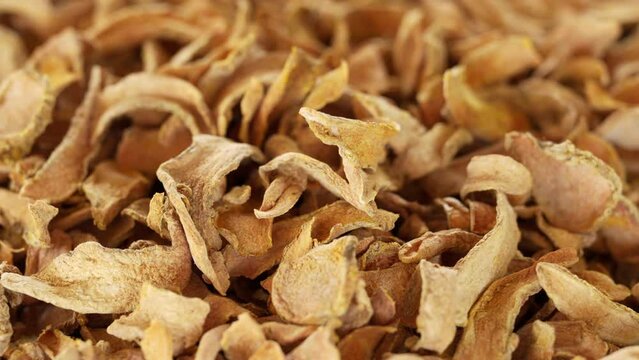 yellow dried turmeric roots rotating, curcumin, curcuma longa, traditional medicine