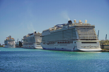 Big modern cruiseship or cruise ship liner Bliss in Port of Miami, Florida with downtown skyline...