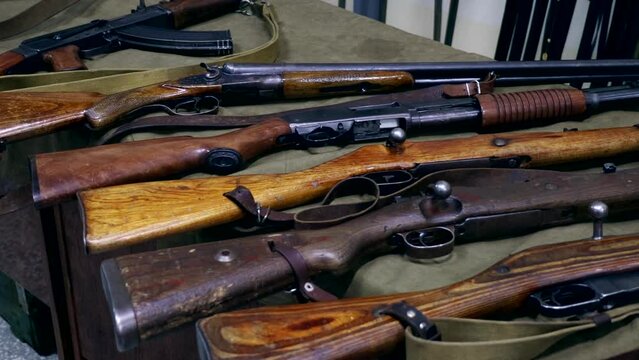 Many different vintage weapon guns close up
