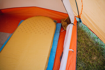 Ideal camping setup includes a cozy tent interior view with a comfortable sleeping pad. Enjoy...