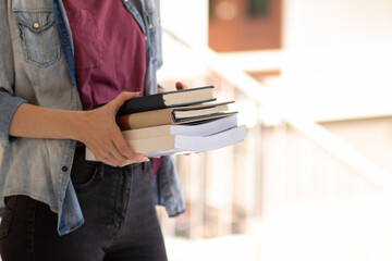 The young woman held a Bible in her hand and tried to learn and understand God teachings from the...