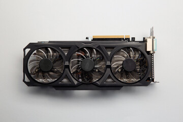 One graphics card on color background, top view