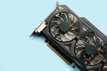 One graphics card on light blue background, top view. Space for text