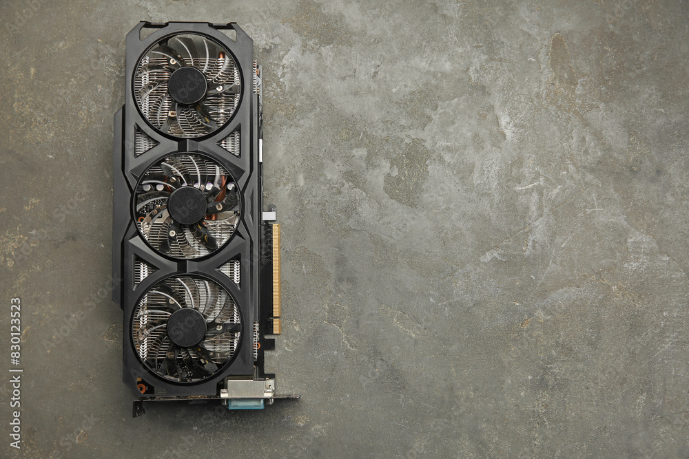 Fototapete one graphics card on grey table, top view. space for text