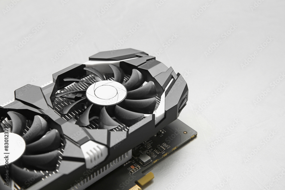 Fototapete computer graphics card on gray textured background, closeup. space for text