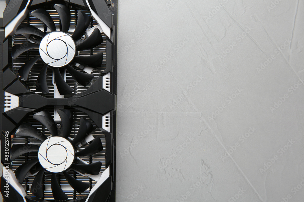 Fototapete computer graphics card on gray textured background, top view. space for text