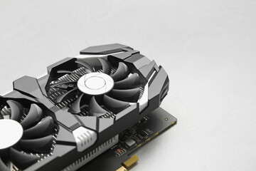 Computer graphics card on gray textured background, closeup. Space for text